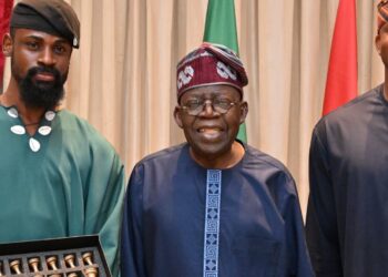 Chess champion Tunde Onakoya presents gold-plated chess to Tinubu